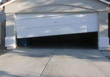 garage door off track repair in in Tujunga